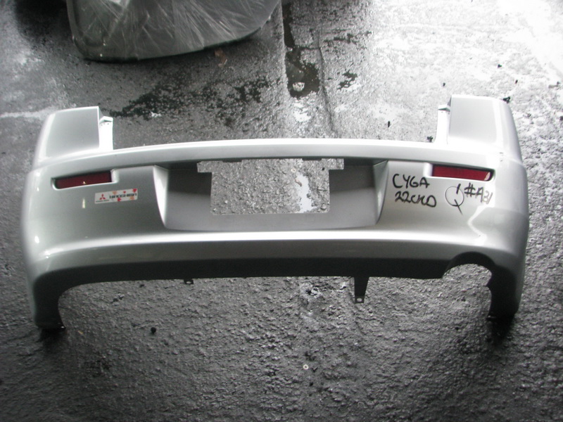 Бампер Mitsubishi Lancer